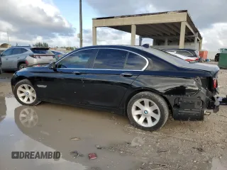 2011 BMW 7 Series 740i with VIN WBAKA4C59BC392351, listed as a Copart auction lot 84942304 with 76,874 mi miles and Salvage Title. Bid and sale history available at carsss.com. Image 2.