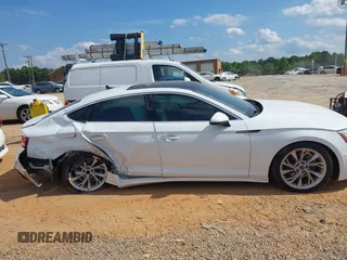 2023 Audi A5 Sportback Premium z VIN WAUABCF57PA020461, wystawiony jako IAAI lot #42230307 z przebiegiem 28 983 mil mil oraz . Historia ofert i sprzedaży dostępna na DreamBid. Obrazek 13.