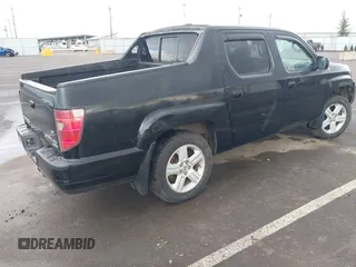 2011 Honda Ridgeline RTL with VIN 5FPYK1F53BB001385, listed as a IAAI auction lot 41945219 with 168,713 mi miles and . Bid and sale history available at DreamBid. Image 4.