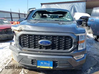 2021 Ford F-150 XL z VIN 1FTEW1C51MFC94173, wystawiony jako IAAI lot #41628222 z przebiegiem 23 266 mil mil oraz . Historia ofert i sprzedaży dostępna na DreamBid. Obrazek 13.