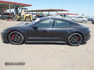 2022 Porsche Taycan GTS z VIN WP0AD2Y12NSA59275, wystawiony jako IAAI lot #42170547 z przebiegiem 43 757 mil mil oraz . Historia ofert i sprzedaży dostępna na DreamBid. Obrazek 14.
