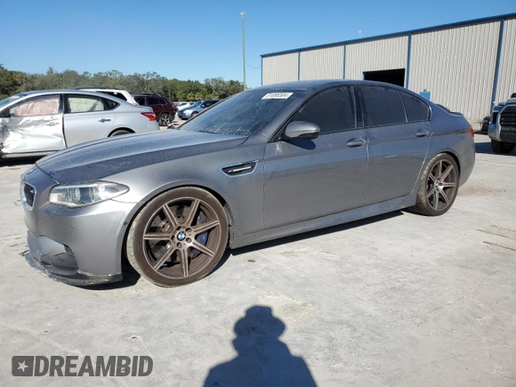 2014 BMW M5 with VIN WBSFV9C52ED097797, listed as a Copart auction lot 81085504 with 83,990 mi miles and Salvage Title. Bid and sale history available at carsss.com. Image 1.