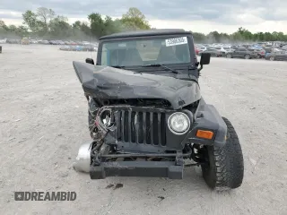 2000 Jeep Wrangler Sport with VIN 1J4FA49S9YP743515, listed as a Copart auction lot 53906305 with 247,349 mi miles and Salvage title. Bid and sale history available at DreamBid. Image 5.