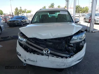 2013 Volkswagen Tiguan SE z VIN WVGAV7AX9DW514874, wystawiony jako IAAI lot #42686433 z przebiegiem 101 782 mil mil oraz . Historia ofert i sprzedaży dostępna na DreamBid. Obrazek 12.