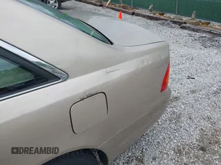 2001 Toyota Avalon XL z VIN 4T1BF28B71U192791, wystawiony jako IAAI lot #42180729 z przebiegiem 132 397 mil mil oraz . Historia ofert i sprzedaży dostępna na DreamBid. Obrazek 13.