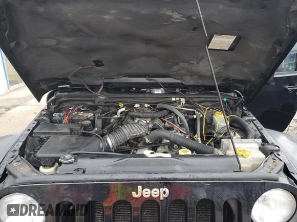 2007 Jeep Wrangler Unlimited Rubicon with VIN 1J8GA69147L113994, listed as a Copart auction lot 86544434 with 100,251 mi miles and Salvage title. Bid and sale history available at DreamBid. Image 11.