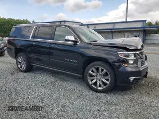 2015 Chevrolet Suburban LTZ with VIN 1GNSKKKC4FR119803, listed as a Copart auction lot 51416775 with 135,366 mi miles and Salvage Title. Bid and sale history available at DreamBid. Image 4.