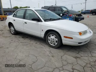 2002 Saturn SL z VIN 1G8ZH52842Z136222, wystawiony jako Copart lot #53687125 z przebiegiem 133 327 mil mil oraz Szkoda całkowita • Salvage title. Historia ofert i sprzedaży dostępna na DreamBid. Obrazek 4.