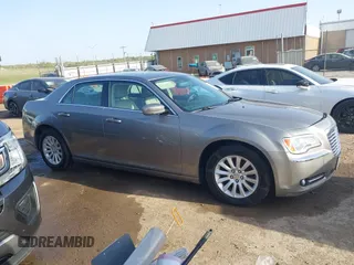 2014 Chrysler 300 with VIN 2C3CCAAG4EH159911, listed as a IAAI auction lot 41963042 with 105,972 mi miles and . Bid and sale history available at DreamBid. Image 13.