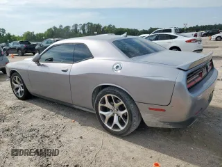 2016 Dodge Challenger SXT z VIN 2C3CDZAG1GH137976, wystawiony jako Copart lot #58702105 z przebiegiem 244 470 mil mil oraz Szkoda całkowita • Salvage title. Historia ofert i sprzedaży dostępna na DreamBid. Obrazek 2.
