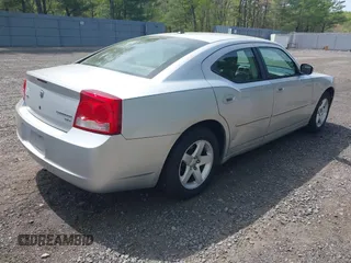 2010 Dodge Charger SXT with VIN 2B3CA3CV8AH277058, listed as a IAAI auction lot 42179056 with 162,971 mi miles. Bid and sale history available at carsss.com. Image 4.