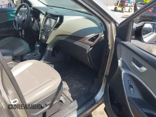 2017 Hyundai Santa Fe 2.4L z VIN 5NMZU3LB7HH025791, wystawiony jako IAAI lot #42277964 z przebiegiem 154 110 mil mil oraz . Historia ofert i sprzedaży dostępna na DreamBid. Obrazek 5.