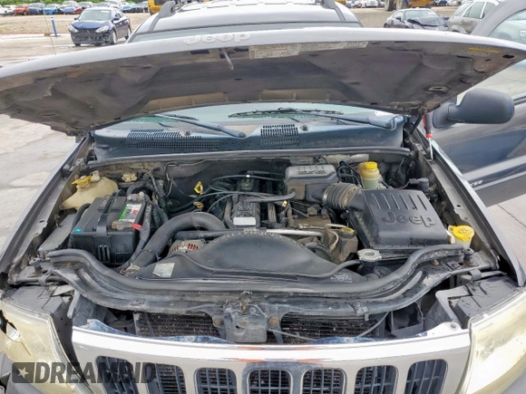2003 Jeep Grand Cherokee Laredo with VIN 1J4GW48SX3C569087, listed as a Copart auction lot 55941035 with Not provided miles and Salvage title. Bid and sale history available at DreamBid. Image 12.