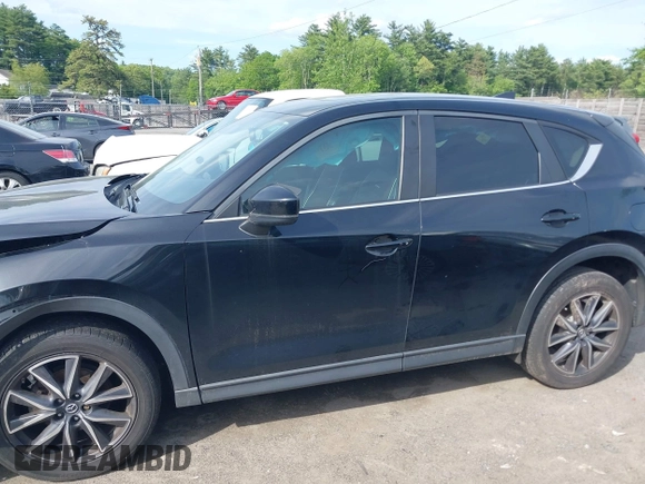 2018 Mazda CX-5 Touring z VIN JM3KFBCM9J0358997, wystawiony jako IAAI lot #42332606 z przebiegiem 93 952 mil mil oraz . Historia ofert i sprzedaży dostępna na DreamBid. Obrazek 14.