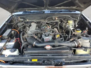 1993 Toyota Pickup z VIN JT4RN13P7P6049713, wystawiony jako Copart lot #58196075 z przebiegiem 151 289 mil mil oraz Tytuł czysty. Historia ofert i sprzedaży dostępna na DreamBid. Obrazek 11.