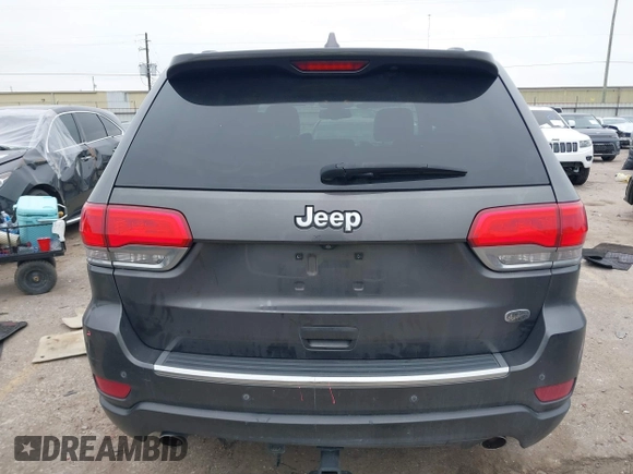 2014 Jeep Grand Cherokee Overland with VIN 1C4RJECG5EC207211, listed as a IAAI auction lot 41586309 with 115,293 mi miles. Bid and sale history available at carsss.com. Image 17.