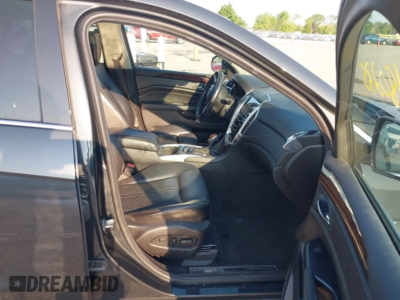 2014 Cadillac SRX Performance Collection with VIN 3GYFNFE35ES663320, listed as a IAAI auction lot 42480235 with 112,406 mi miles and . Bid and sale history available at DreamBid. Image 5.