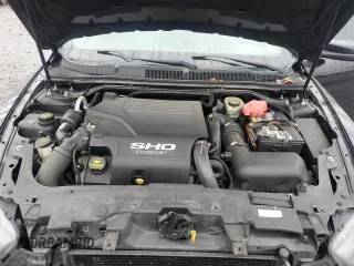 2013 Ford Taurus SHO z VIN 1FAHP2KTXDG168636, wystawiony jako Copart lot #56921795 z przebiegiem 121 103 mil mil oraz Szkoda całkowita • Salvage title. Historia ofert i sprzedaży dostępna na DreamBid. Obrazek 11.