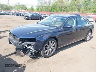 2014 Audi A8 3.0T z VIN WAURGAFD7EN005979, wystawiony jako IAAI lot #42169900 z przebiegiem 126 523 mil mil oraz . Historia ofert i sprzedaży dostępna na DreamBid. Obrazek 2.