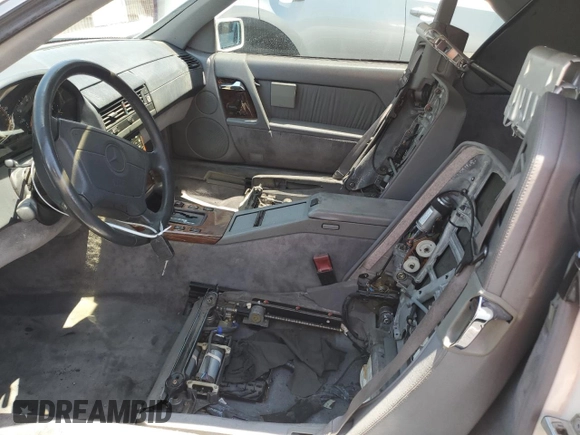 1994 Mercedes-Benz SL z VIN WDBFA63EXRF097007, wystawiony jako Copart lot #59714045 z przebiegiem Nie podano mil oraz Szkoda całkowita • Salvage title. Historia ofert i sprzedaży dostępna na DreamBid. Obrazek 7.
