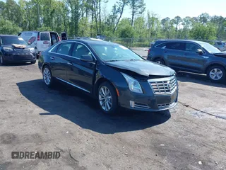 2014 Cadillac XTS Luxury z VIN 2G61M5S37E9211547, wystawiony jako IAAI lot #42373128 z przebiegiem 146 354 mil mil oraz . Historia ofert i sprzedaży dostępna na DreamBid. Obrazek 1.