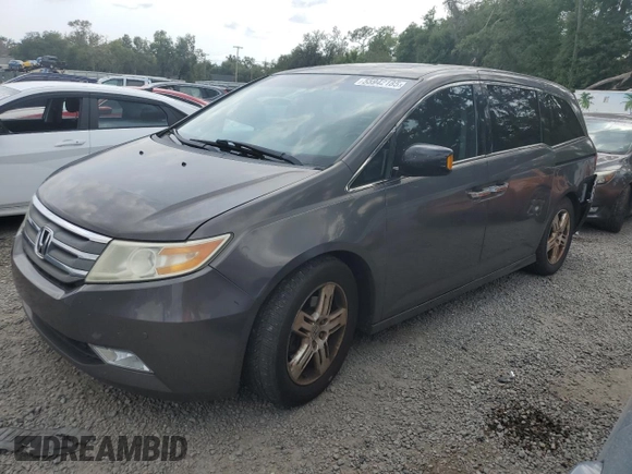2012 Honda Odyssey Touring with VIN 5FNRL5H94CB102177, listed as a Copart auction lot 55942185 with 179,418 mi miles and Salvage Title. Bid and sale history available at DreamBid. Image 1.