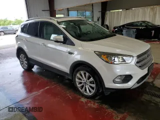 2018 Ford Escape Titanium с VIN 1FMCU9J90JUB30658, выставлен на аукционе Copart как лот 64001665 с пробегом 61 970 миль миль и Списание • Salvage title. История ставок и продаж доступна на DreamBid. Изображение 4.