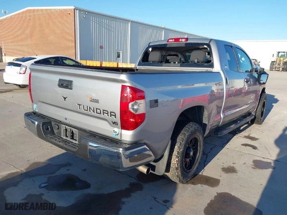 2014 Toyota Tundra 2WD Truck SR with VIN 5TFRM5F11EX079654, listed as a IAAI auction lot 41320363 with 140,514 mi miles. Bid and sale history available at carsss.com. Image 4.