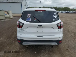 2018 Ford Escape SE z VIN 1FMCU9G97JUB48596, wystawiony jako Copart lot #56388505 z przebiegiem 96 996 mil mil oraz Czysty tytuł • Clean title. Historia ofert i sprzedaży dostępna na DreamBid. Obrazek 6.