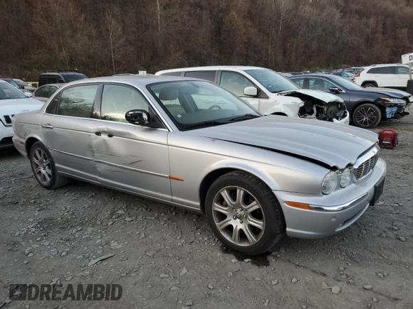 2005 Jaguar XJ with VIN SAJWA79C55SG37981, listed as a Copart auction lot 81142484 with 128,601 mi miles and Salvage Title. Bid and sale history available at carsss.com. Image 4.