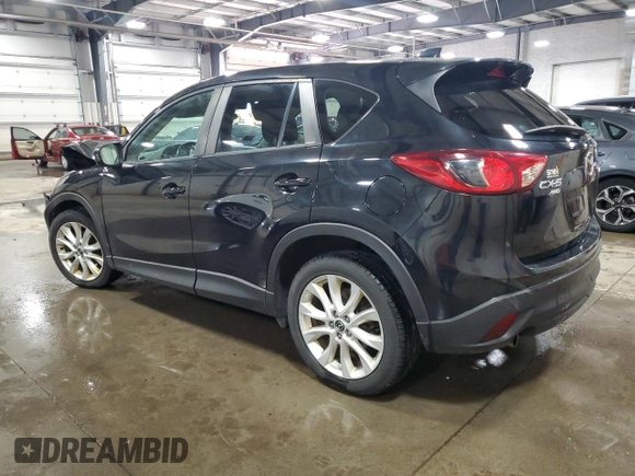 2014 Mazda CX-5 Grand Touring with VIN JM3KE4DY0E0322606, listed as a Copart auction lot 54381815 with 216,022 mi miles and Salvage Title. Bid and sale history available at DreamBid. Image 2.