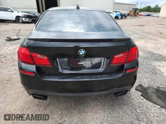 2013 BMW 5 Series 550i xDrive with VIN WBAFU9C55DDY72065, listed as a Copart auction lot 63023675 with 117,592 mi miles and Salvage title. Bid and sale history available at DreamBid. Image 6.
