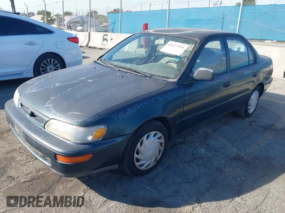 1997 Toyota Corolla with VIN 1NXBA02E5VZ595972, listed as a IAAI auction lot 41622050 with 143,577 mi miles and . Bid and sale history available at DreamBid. Image 2.