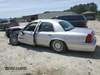 2010 Mercury Grand Marquis LS z VIN 2MEBM7FV2AX620357, wystawiony jako Copart lot #57396825 z przebiegiem 72 257 mil mil oraz Szkoda całkowita • Salvage title. Historia ofert i sprzedaży dostępna na DreamBid. Obrazek 2.