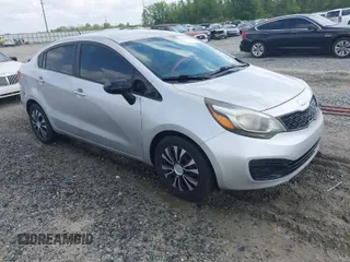 2015 Kia Rio LX with VIN KNADM4A32F6500489, listed as a IAAI auction lot 41943956 with 195,493 mi miles. Bid and sale history available at carsss.com. Image 1.
