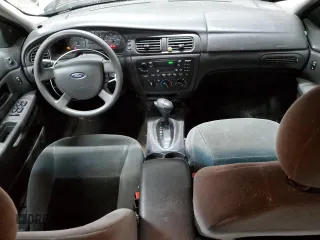 2004 Ford Taurus SE with VIN 1FAFP53224G175353, listed as a Copart auction lot 52713935 with 213,375 mi miles and Salvage Title. Bid and sale history available at DreamBid. Image 8.