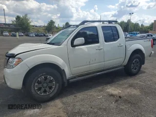 2014 Nissan Frontier Pro-4X with VIN 1N6AD0EV1EN741455, listed as a Copart auction lot 61715395 with 111,861 mi miles and Salvage title. Bid and sale history available at DreamBid. Image 1.
