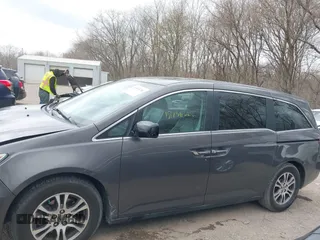 2012 Honda Odyssey EX-L with VIN 5FNRL5H60CB081866, listed as a IAAI auction lot 41835701 with 151,236 mi miles and . Bid and sale history available at DreamBid. Image 14.