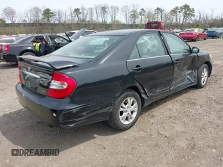 2004 Toyota Camry LE with VIN 4T1BF32KX4U077010, listed as a IAAI auction lot 42039297 with 113,742 mi miles. Bid and sale history available at carsss.com. Image 4.
