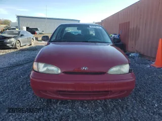 1997 Hyundai Accent z VIN KMHVF24N5VU369924, wystawiony jako Copart lot #85036114 z przebiegiem 168 797 mil mil oraz Szkody całkowita. Historia ofert i sprzedaży dostępna na DreamBid. Obrazek 5.