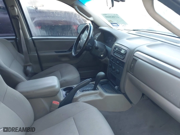 2004 Jeep Grand Cherokee Laredo with VIN 1J4GX48S04C394024, listed as a IAAI auction lot 41982608 with 142,825 mi miles. Bid and sale history available at carsss.com. Image 5.