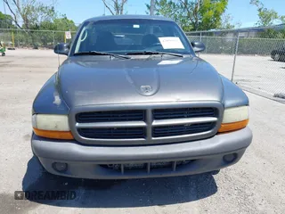 2003 Dodge Dakota with VIN 1D7FL16X53S361797, listed as a IAAI auction lot 42056555 with 243,771 mi miles and . Bid and sale history available at carsss.com. Image 13.