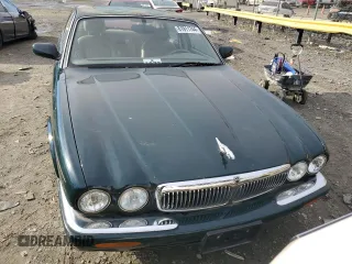 1998 Jaguar XJ with VIN SAJHX1241WC839104, listed as a Copart auction lot 81911744 with 61,956 mi miles and Clean title. Bid and sale history available at DreamBid. Image 5.