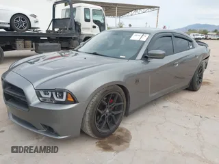 2012 Dodge Charger SXT with VIN 2C3CDXHG8CH244592, listed as a IAAI auction lot 41548991 with 116,855 mi miles. Bid and sale history available at carsss.com. Image 2.