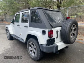 2016 Jeep Wrangler Unlimited 75th Anniversary with VIN 1C4BJWEG5GL215915, listed as a Copart auction lot 52680895 with 143,836 mi miles and Clean title. Bid and sale history available at DreamBid. Image 3.