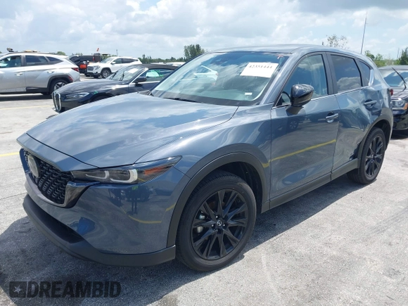 2024 Mazda CX-5 S Carbon Edition z VIN JM3KFBCLXR0521353, wystawiony jako IAAI lot #42351444 z przebiegiem 17 270 mil mil oraz . Historia ofert i sprzedaży dostępna na DreamBid. Obrazek 17.