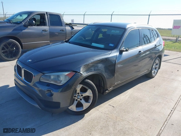 2014 BMW X1 sDrive28i with VIN WBAVM1C57EVW47767, listed as a IAAI auction lot 41867313 with 90,431 mi miles. Bid and sale history available at carsss.com. Image 2.