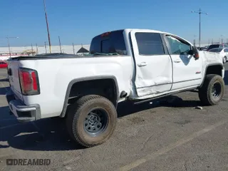 2016 GMC Sierra 1500 SLT with VIN 3GTU2NEC2GG244329, listed as a IAAI auction lot 40810002 with 121,716 mi miles. Bid and sale history available at carsss.com. Image 4.