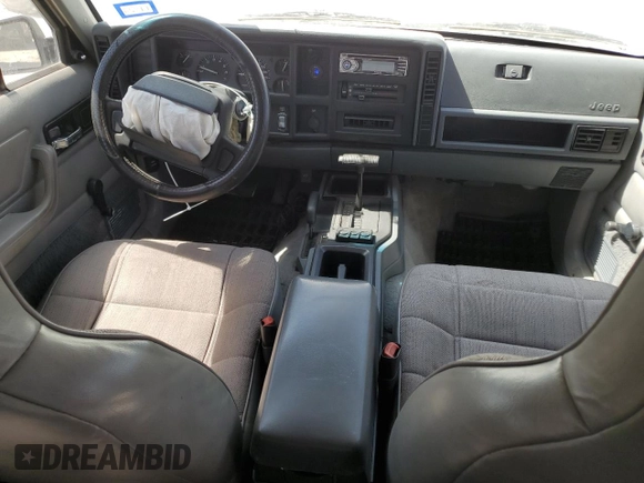 1996 Jeep Cherokee Sport with VIN 1J4FJ68S1TL128597, listed as a Copart auction lot 49600545 with 201,074 mi miles and Salvage title. Bid and sale history available at DreamBid. Image 8.