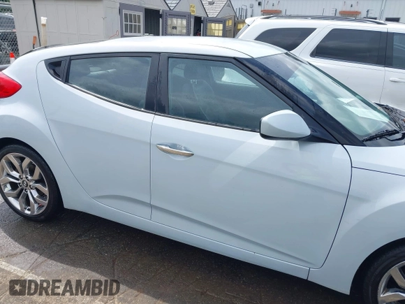 2015 Hyundai Veloster z VIN KMHTC6AD8FU222744, wystawiony jako IAAI lot #42129397 z przebiegiem Nie podano mil oraz . Historia ofert i sprzedaży dostępna na DreamBid. Obrazek 12.
